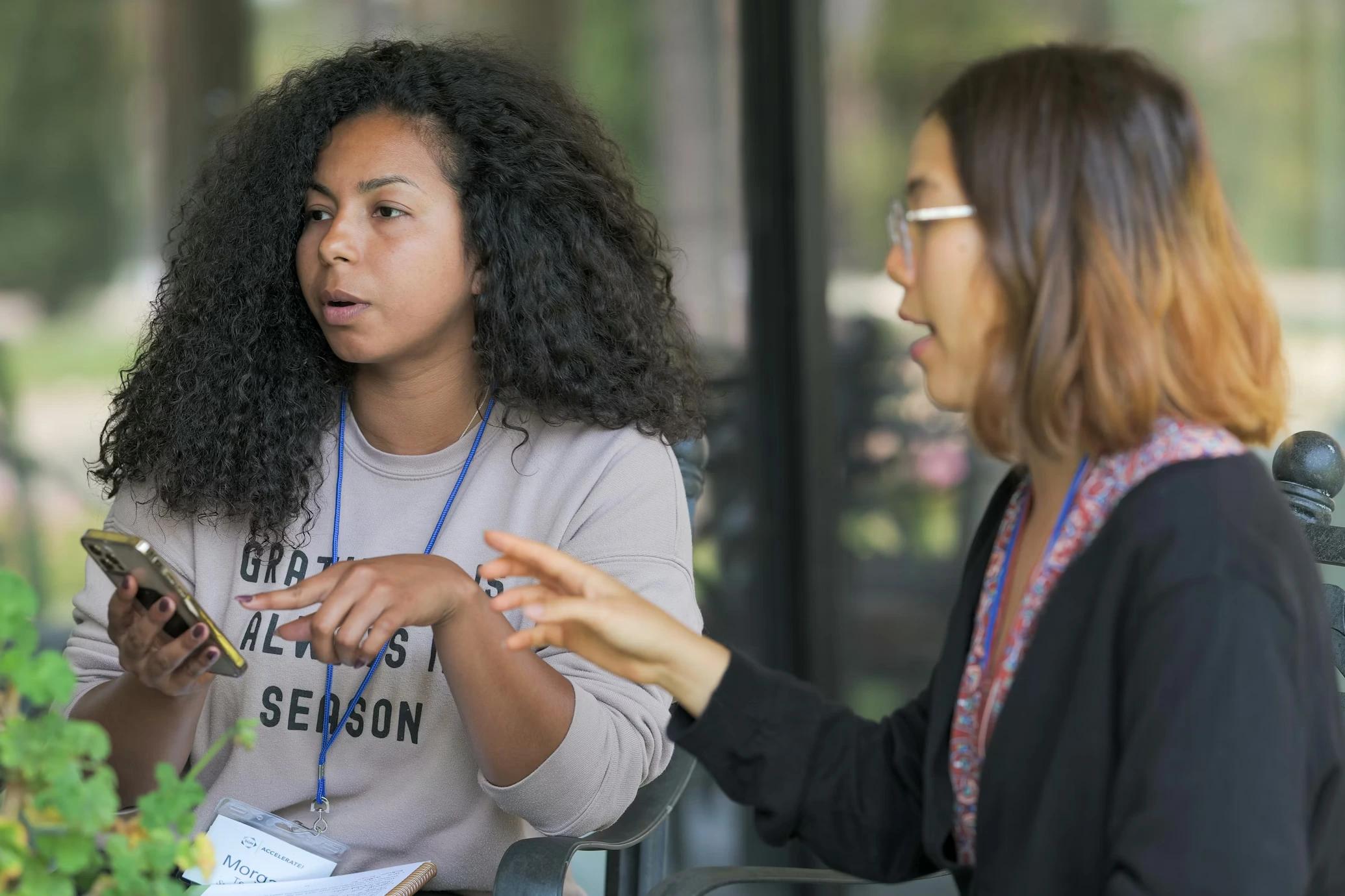 Community members discussing and using mobile devices